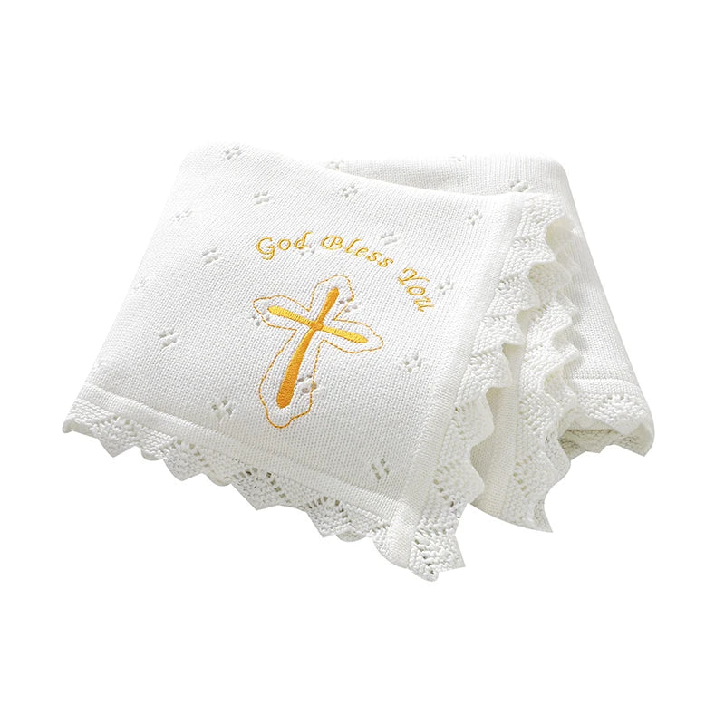 White cotton knit baby baptism blanket with gold cross and God Bless You, crocheted lace edging.