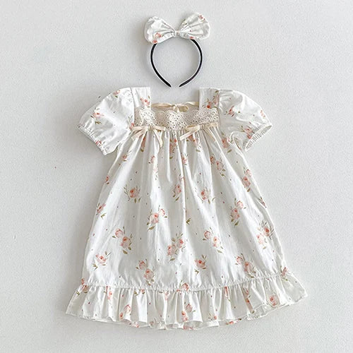 Vintage Outfits for babies, featuring a floral dress with a bow headband, perfect for stylish and elegant occasions.