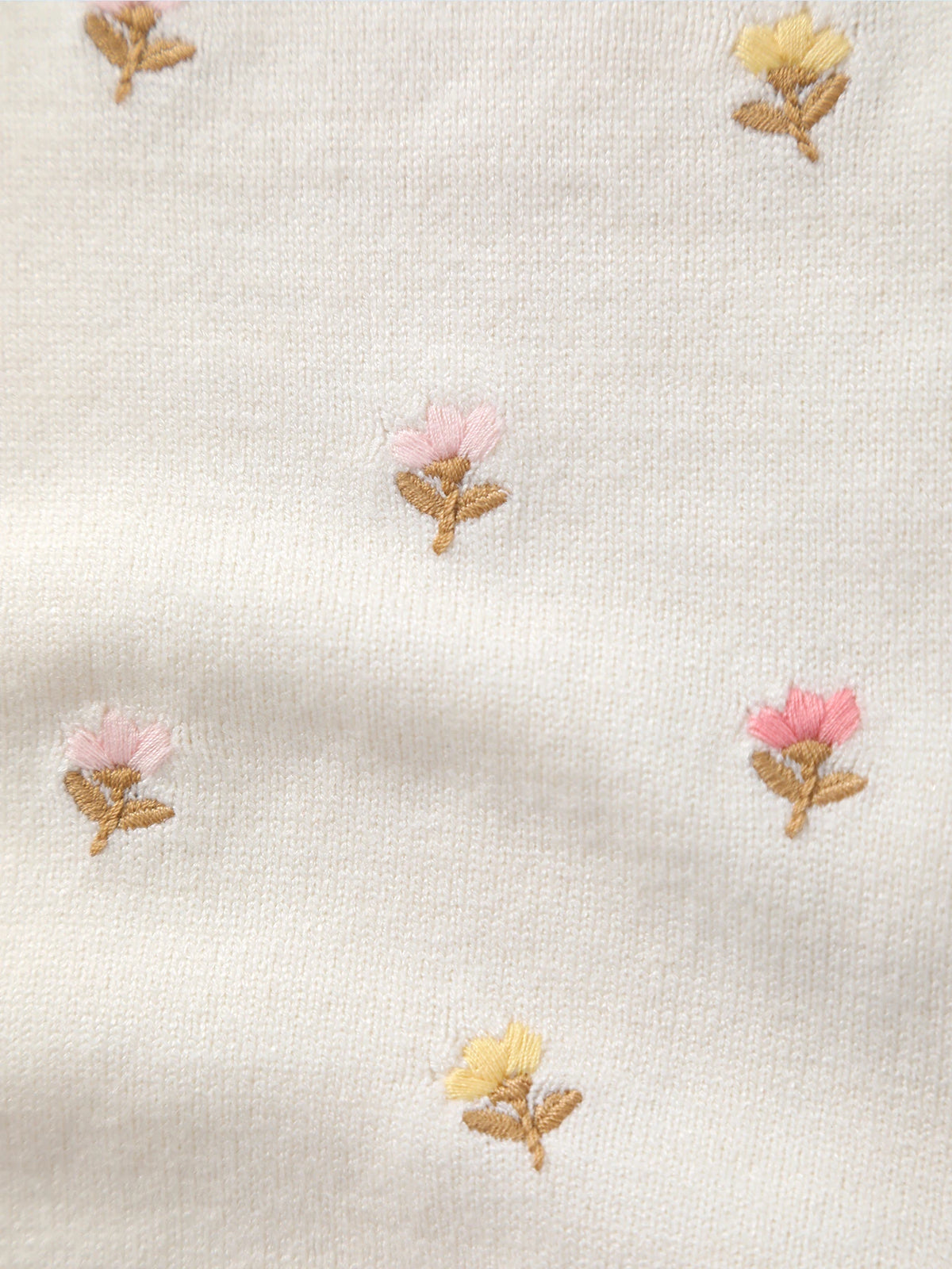 Cream knit fabric with small pink and yellow embroidered flowers for a Summer Thin Frilly Floral Knit Romper