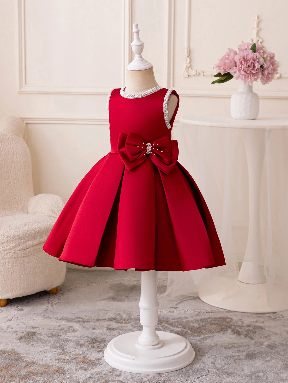Red Taylor Elegant Beaded Formal Party Dress for girls 2–7 with beaded neckline and bow, knee-length pleated skirt.