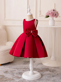 Red Taylor Elegant Beaded Formal Party Dress for girls 2–7 with beaded neckline and bow, knee-length pleated skirt.