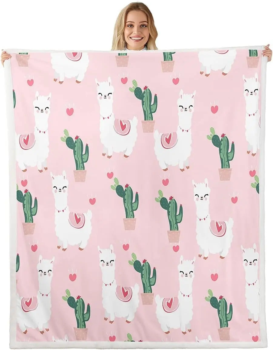 Jungle Rumble double-sided children's blanket featuring white llamas, cacti, and hearts on pink background.