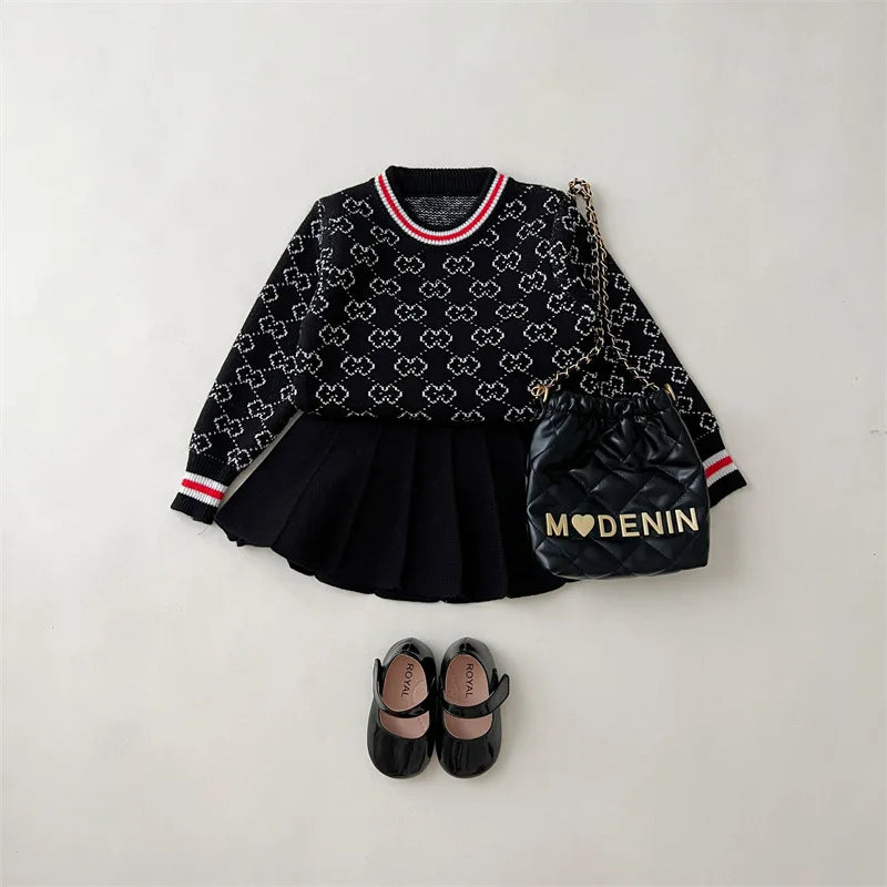 The complete look of the "Morgan" Classic Knit Skirt Set styled with accessories, showcasing a trendy outfit for young girls.