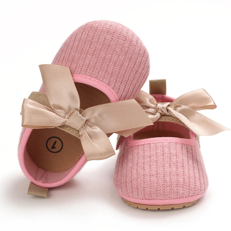 Baby Jane Satin Bow Baby Shoes in pink, adorned with a lovely satin bow, ideal for stylish little ones.