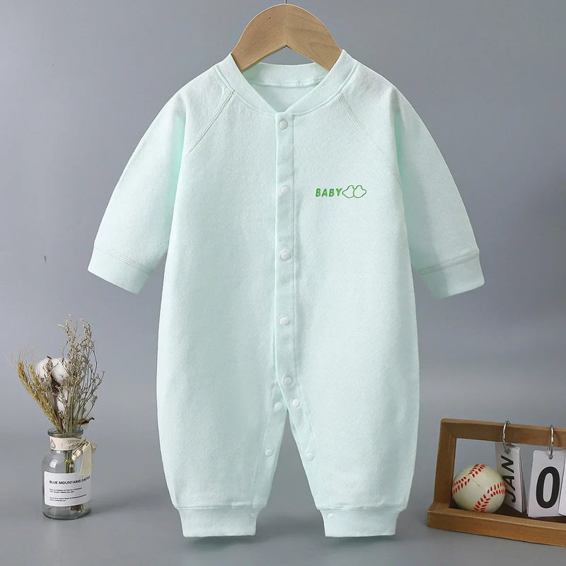Rowan Baby's Romper in soft green shade, designed for infants aged 6 to 18 months, featuring playful prints and a convenient snapped front for easy diaper changes. Perfect for casual or special occasions.