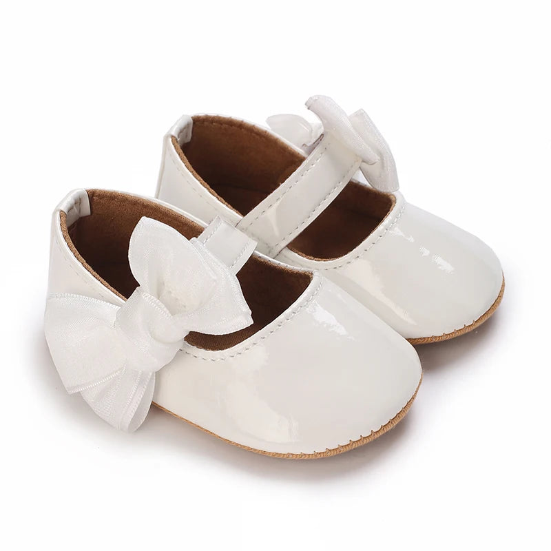 Serena Bow First Walker Shoes - Stylish white Toddler shoes with a butterfly-knot bow, perfect for baby girls.