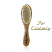 Personalized wooden baby brush for infants and toddlers with engraved name.