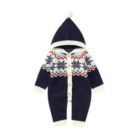 Festive winter knit romper with a reindeer character, suitable for children, showcased with a playful hat, from the 'Winter Sweeties' collection.