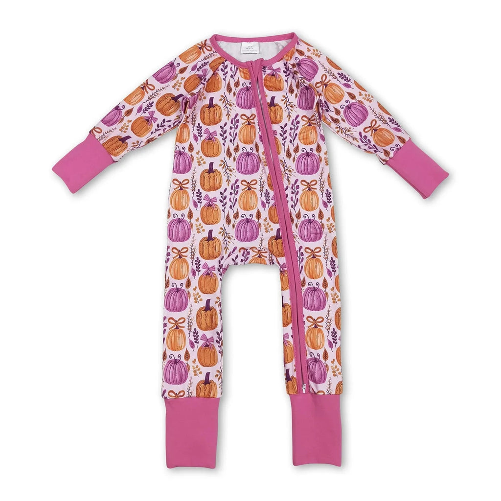 Front view of the 'Pumpkins and Flowers' romper zippered front in hot pink, showcasing pumpkin and floral prints.