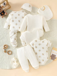 Little Bear beige 8-piece newborn romper set, 100% cotton; bear-pattern footed sleepers, hat, bib and bodysuits.