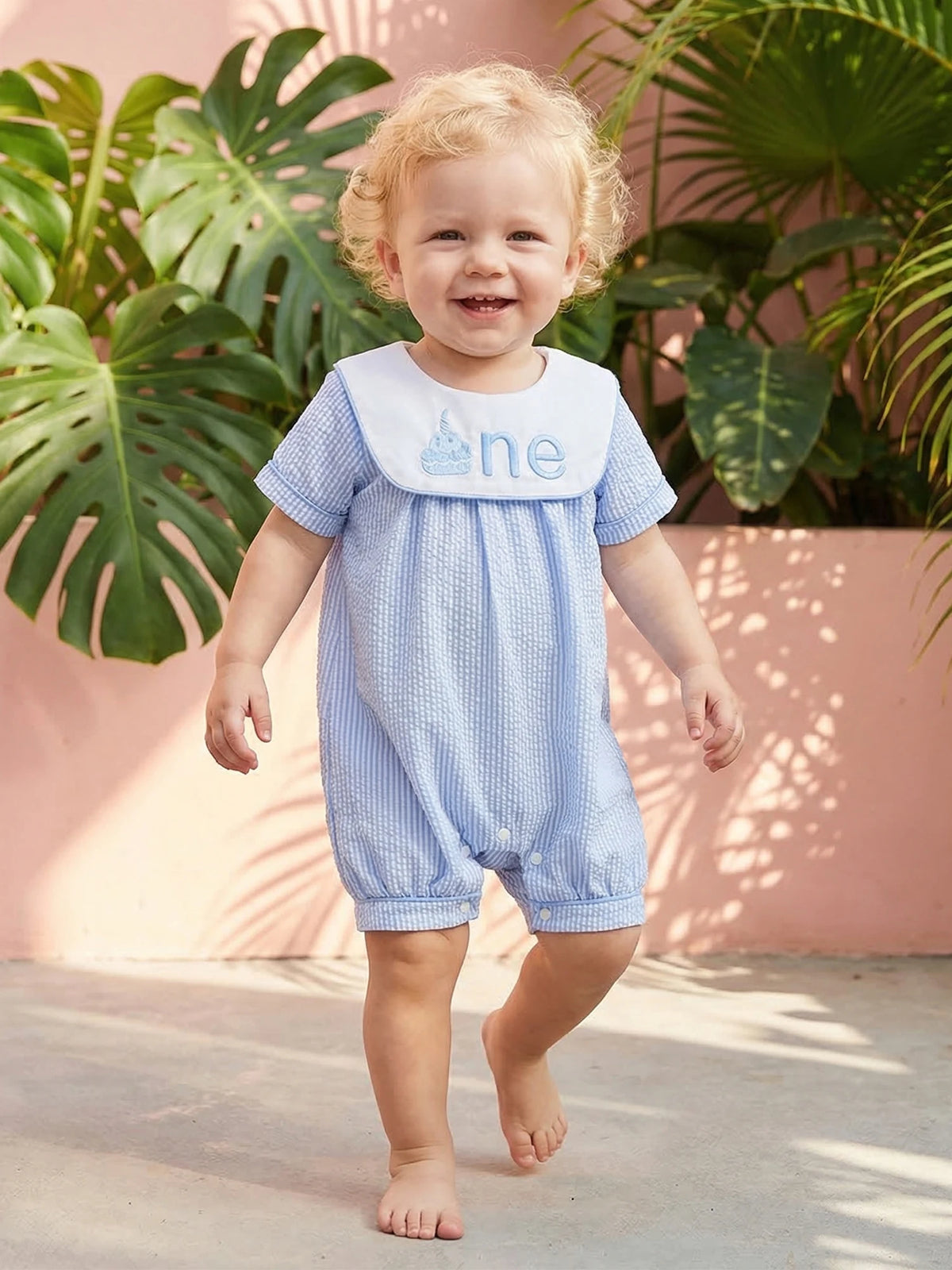 The Sweet Birthday Wishes First Birthday Romper with Embroidered Bib, an ideal outfit for photo sessions at first birthday parties.