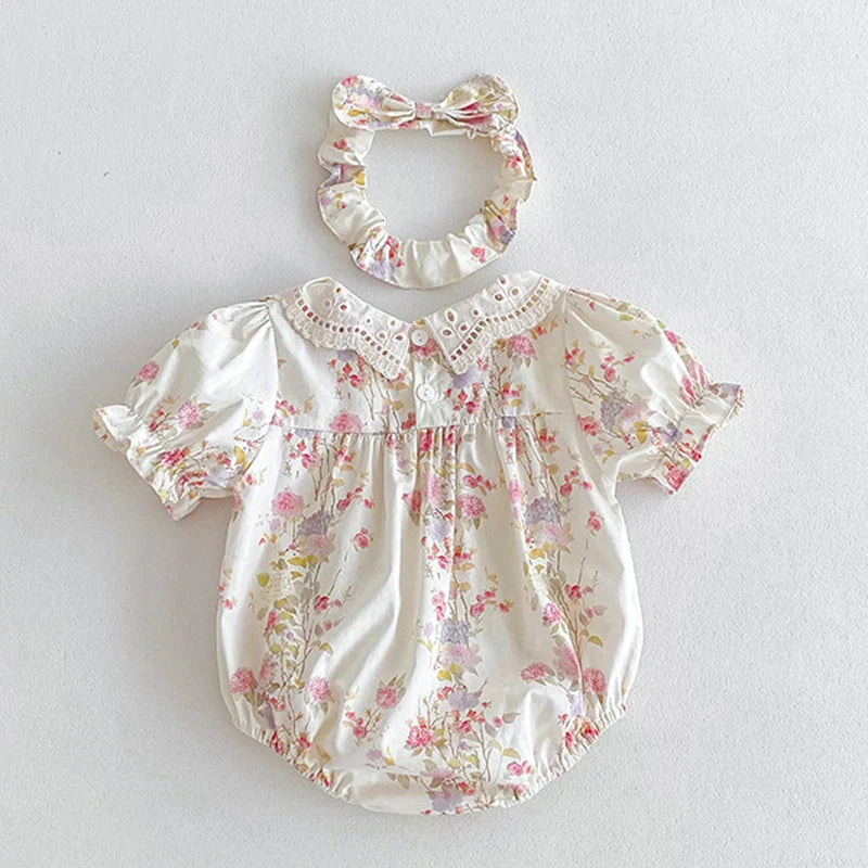 Vintage Outfits for babies featuring a floral patterned top and matching headband. Perfect for elegant occasions.