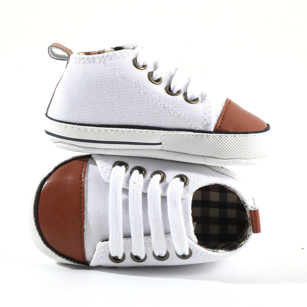 Baby's Canvas Lace-up Soft Sole First Walkers - Sophisticated Brown Tip with trendy faux leather brown tip on a white canvas upper, perfect for baby's first steps.