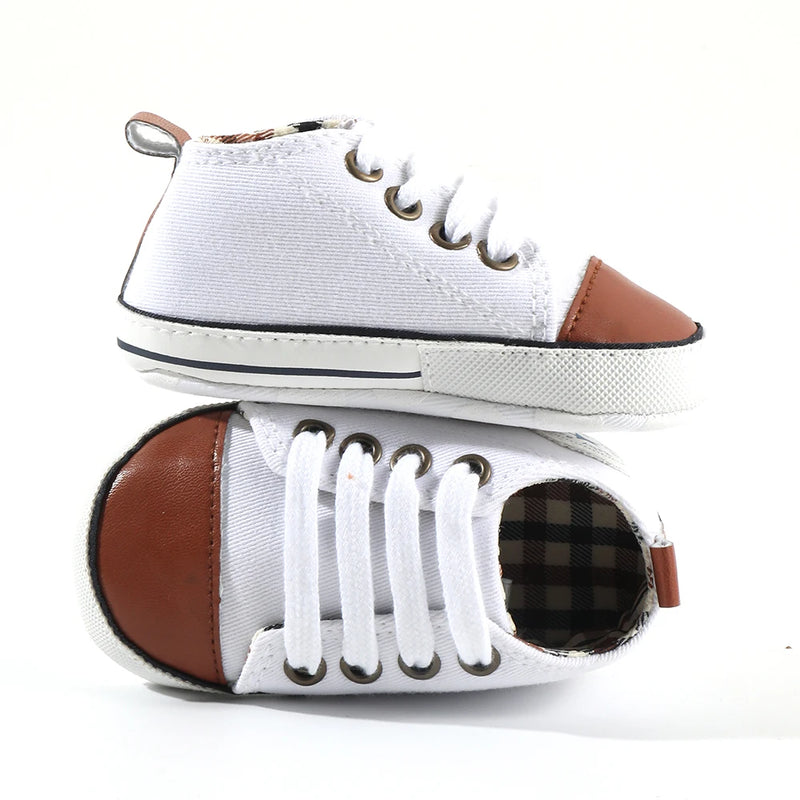 Baby's Canvas Lace-up Soft Sole First Walkers - Sophisticated Brown Tip with trendy faux leather brown tip on a white canvas upper, perfect for baby's first steps.