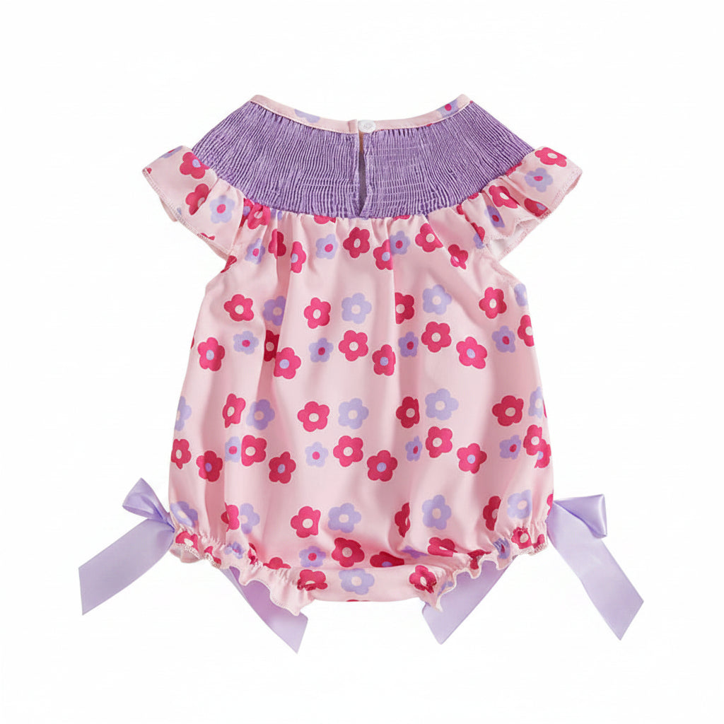 pink and purple floral romper for babies with gathered purple yoke and lavender side bows