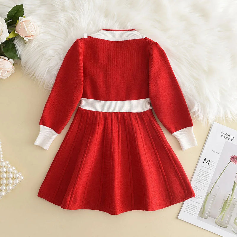 Back view of the Chic Melinda Knit Dress in red featuring a flared skirt and stylish design, ideal for festive occasions.