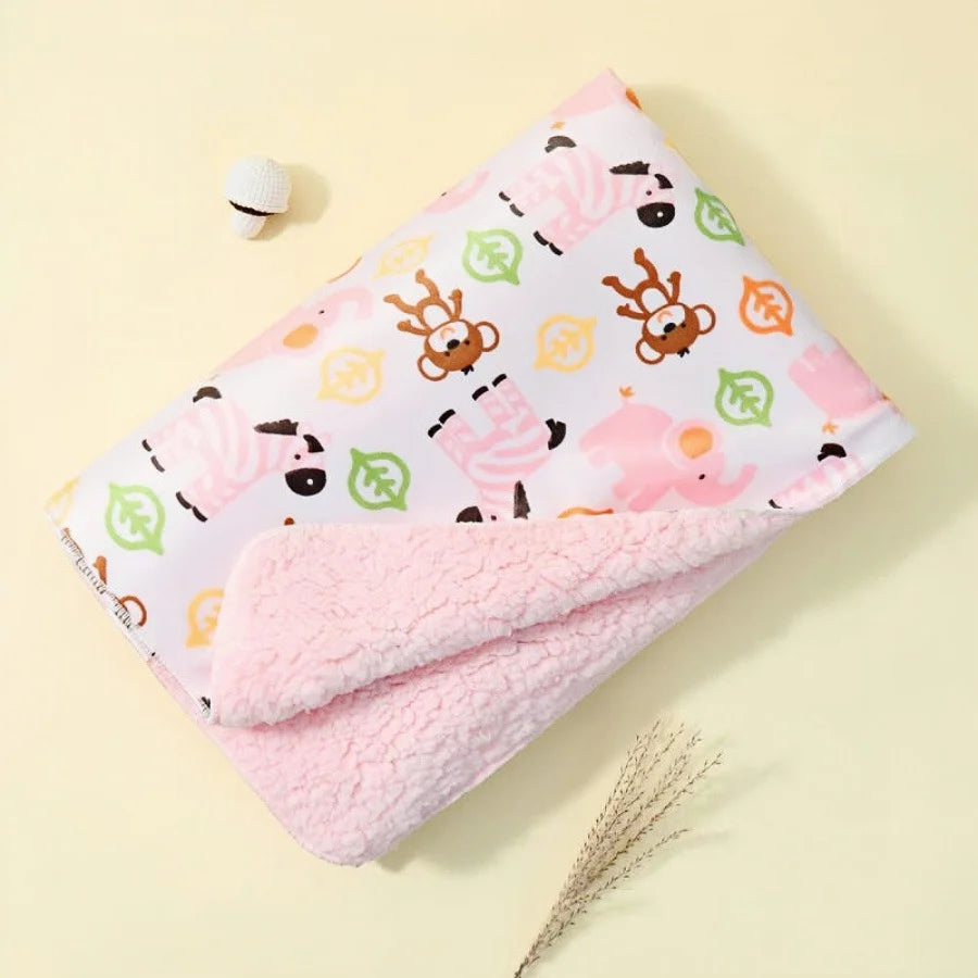 Pink reversible micro-plush kid blanket with 4 colorful animal prints.