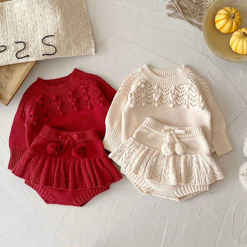 Pretty in Knit ensemble featuring a deep red pullover and beige toddler skorts, ideal for stylish toddlers.