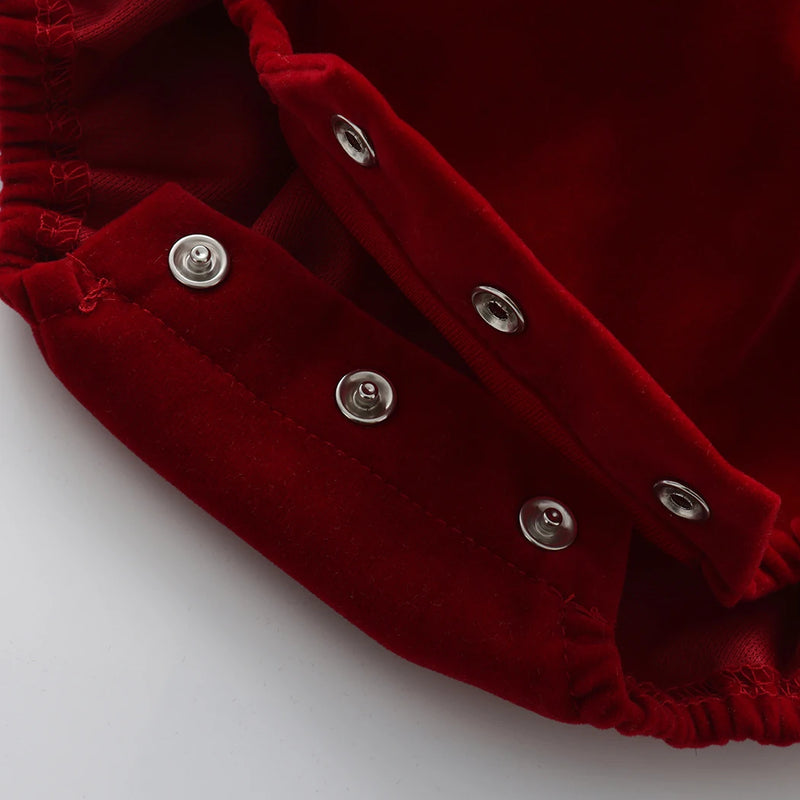 Close-up of the snap closures on the Little Sofie Velvet Frilly Bubble, providing convenience and comfort for little ones, making it a perfect frilly bubble romper.