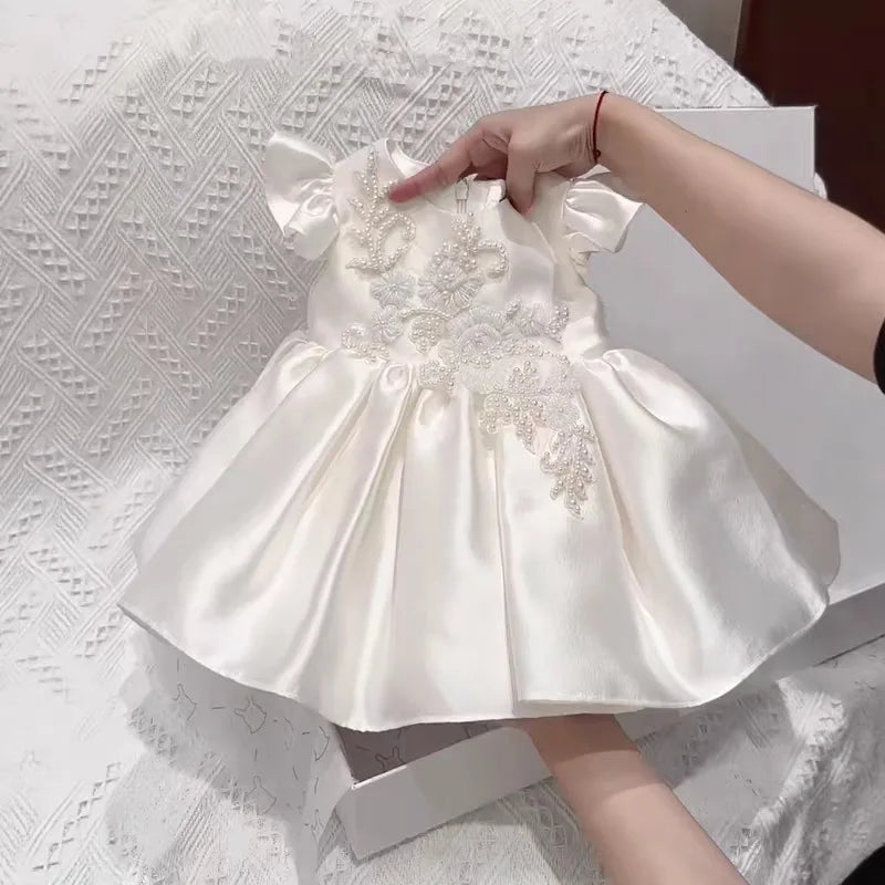 Astrid Satin Flutter Sleeve Princess Dress for Little Girls, white satin with beaded bodice and ruched flare skirt.
