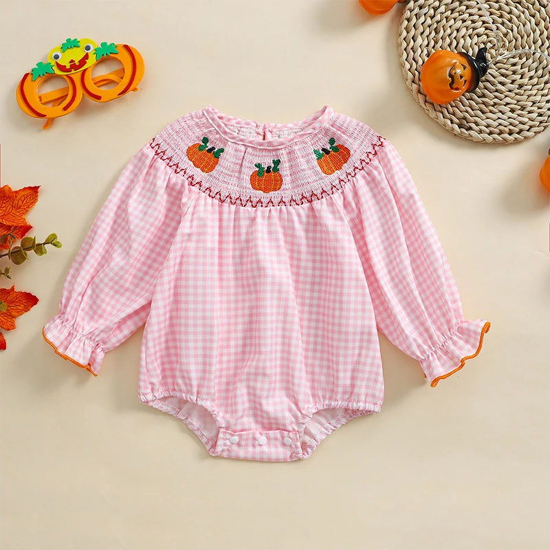 Holiday Cuteness Smocked Baby Bubbles in pink gingham with pumpkin embroidery, perfect for festive occasions.