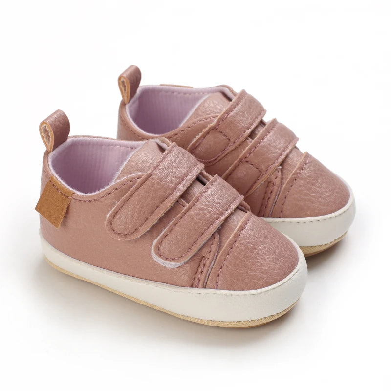 Close-up of Babies' Faux Leather Rubber Soled Lace-ups featuring durable PU leather and soft rubber soles for comfort during first steps.