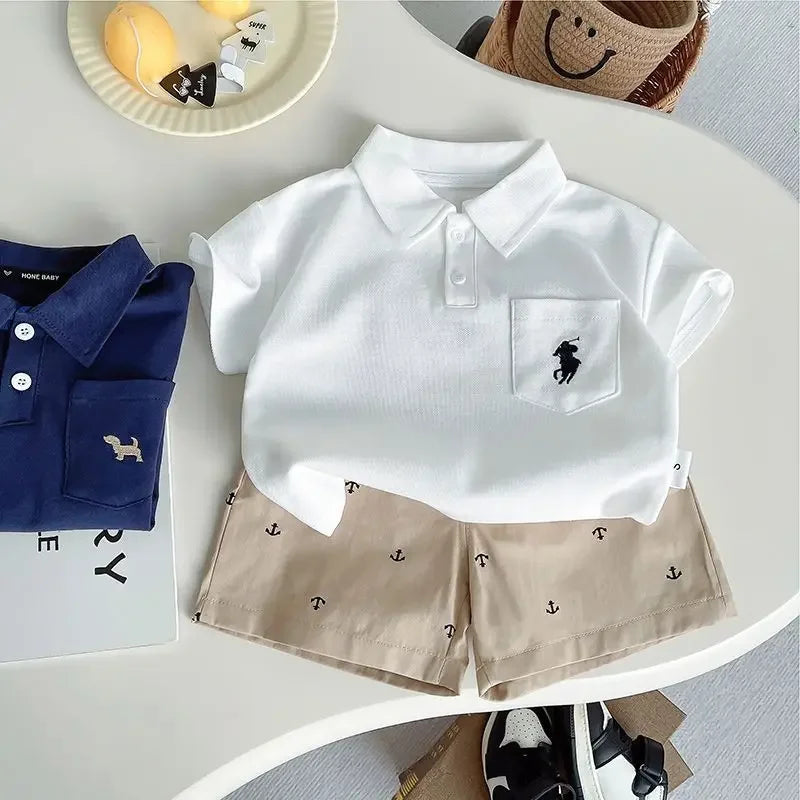 The Preppy 'Daron' 2 PC Kids Khaki Shorts Set in white polo style shirt paired with khaki shorts, designed for boys and girls aged 12 months to 6 years.