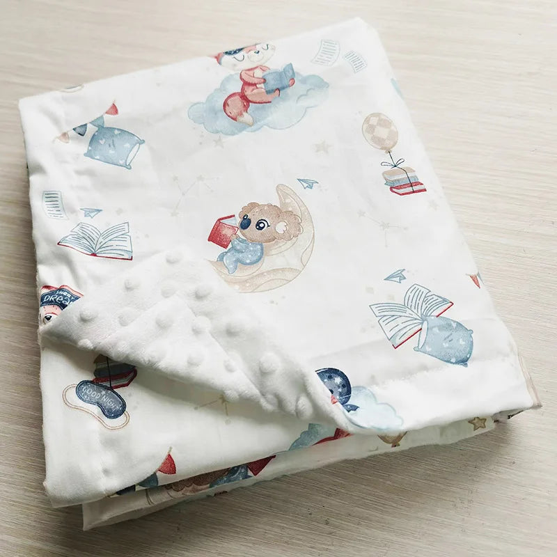 F旧 folded white minky baby blanket featuring cute koala reading on a moon, stars, and books. Soft, durable 100x75cm design for infants.