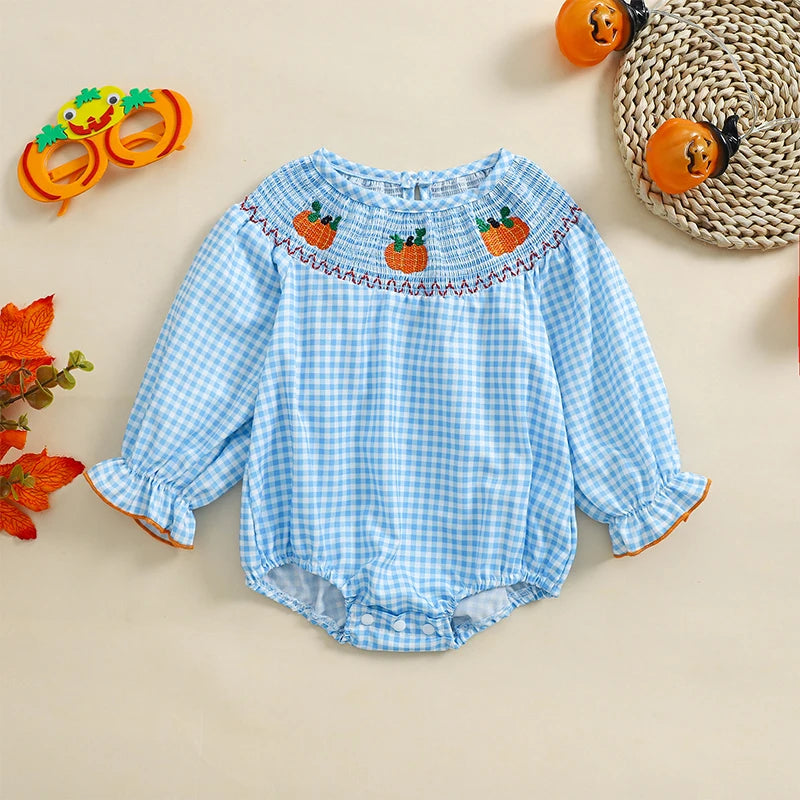 Holiday Cuteness Smocked Baby Bubbles in pale blue gingham with pumpkin designs, perfect for capturing family holiday photos.