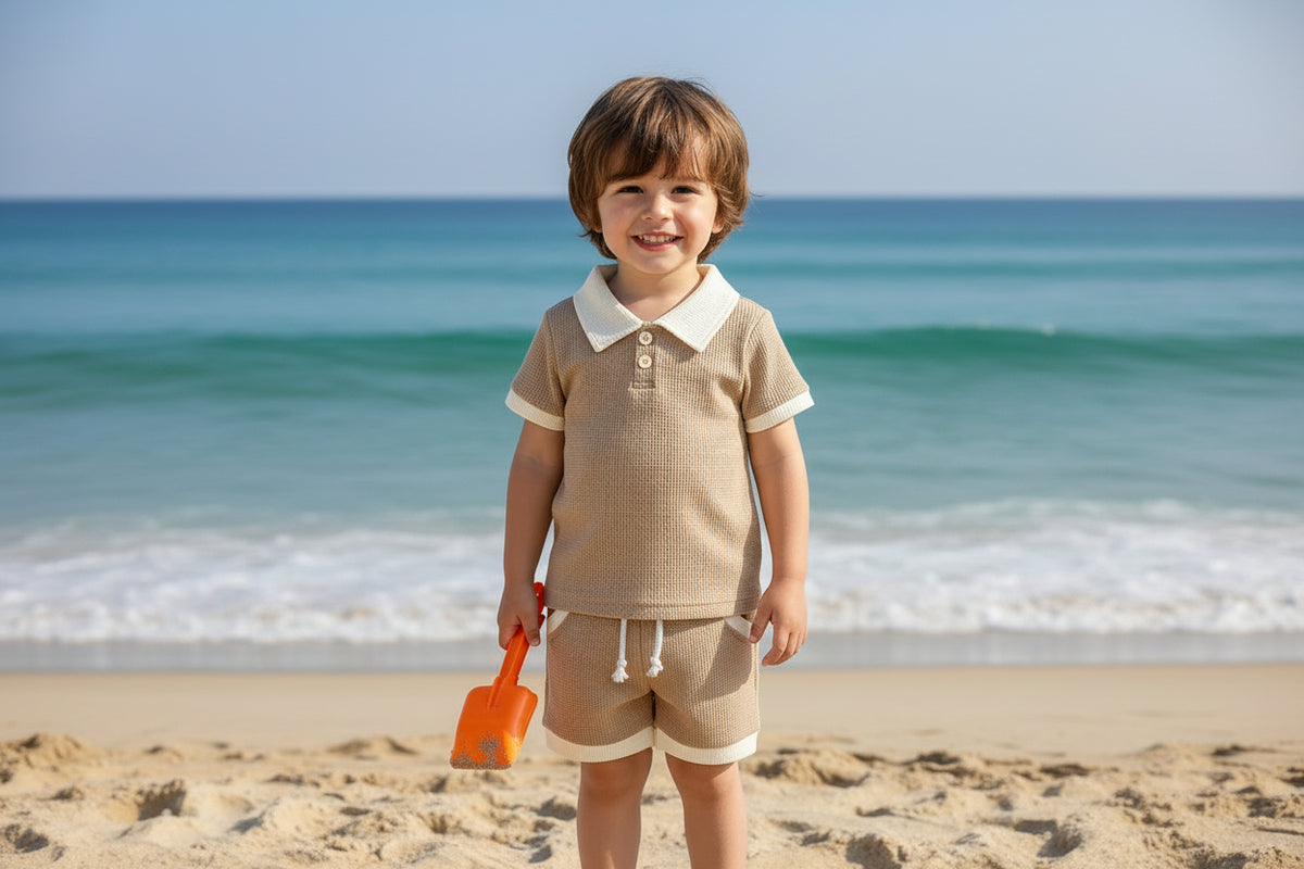 Children's brown checkered outfit with white collar and shorts on a white background