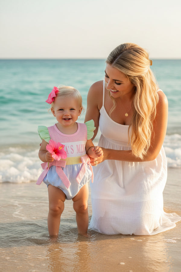 Baby romper with 'MAMA'S MINI' text on a white background