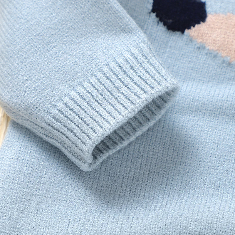 Close-up of the sleeve detail on the "Doxie Dashound" Embroidered Baby Sweater Romper in light blue.