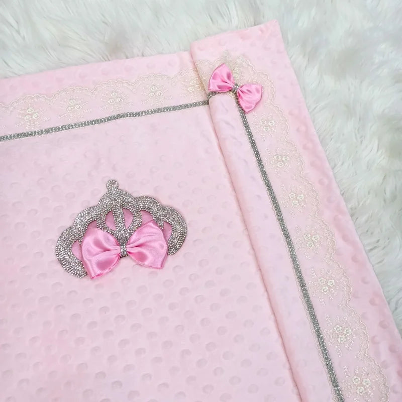 Exquisite pink Neo-Rococo heirloom baby blanket with silver trim, crystal crown and pink bow on raised-dots Minky.