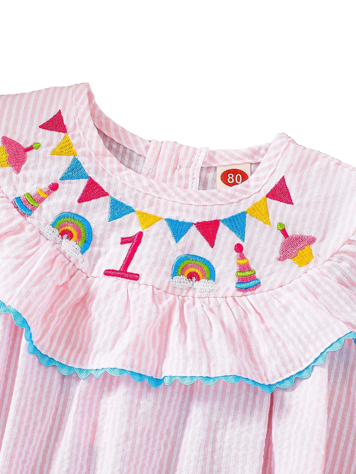 Pink seersucker birthday bubble dress with embroidered birthday motifs, ruffled neckline, Atlantic blue trim, leg snaps.