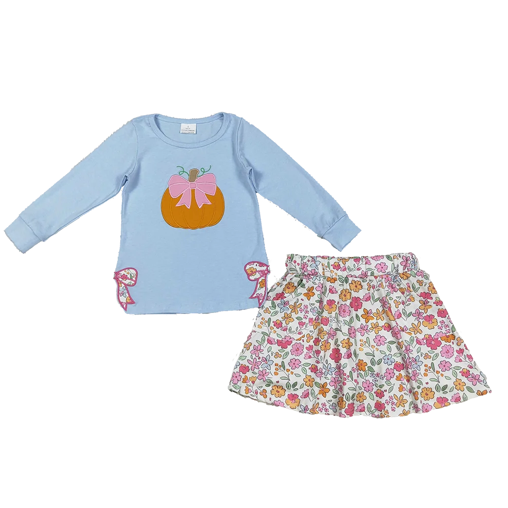 Pumpkin Fleurs Baby Girls' Embroidered Skort Outfit featuring a long-sleeved Newport blue top with an embroidered pumpkin and floral-printed skort.