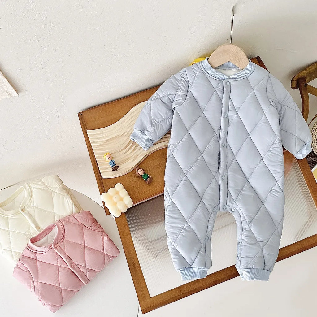 Baby quilted romper in Sweet Cream, Precious Baby Blue, and Princess Pink colors, perfect for keeping little ones toasty warm.