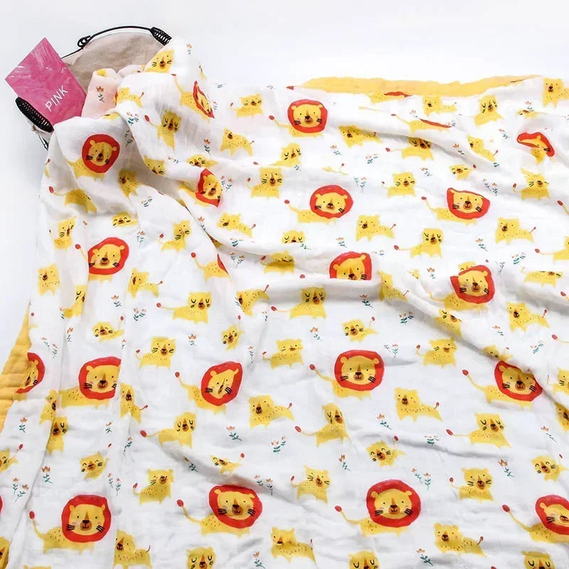 Two-layer bamboo-cotton baby swaddle blanket with lion and kitten print on white fabric.