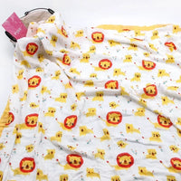 Two-layer bamboo-cotton baby swaddle blanket with lion and kitten print on white fabric.