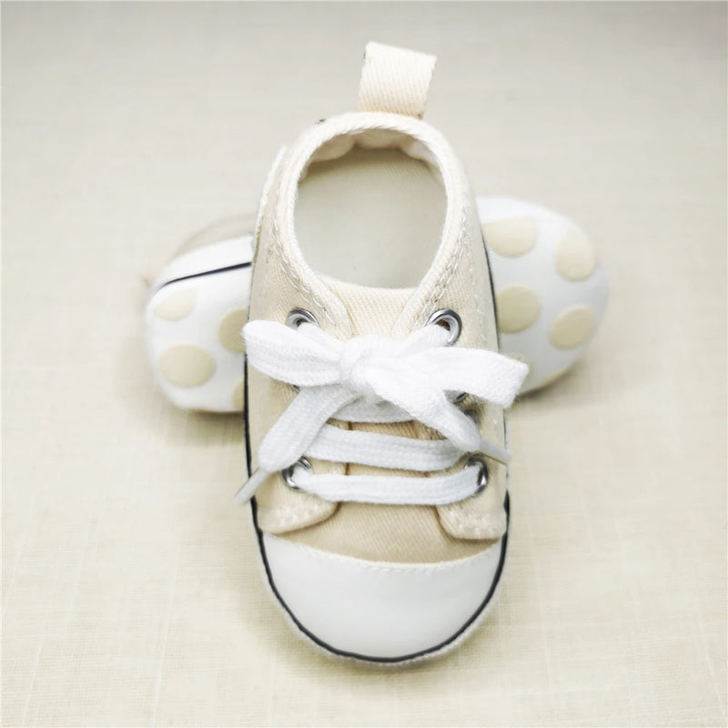 Baby's Canvas Soft-Sole Lace-up First Walkers in khaki, designed for comfort and safety as infants take their first steps.