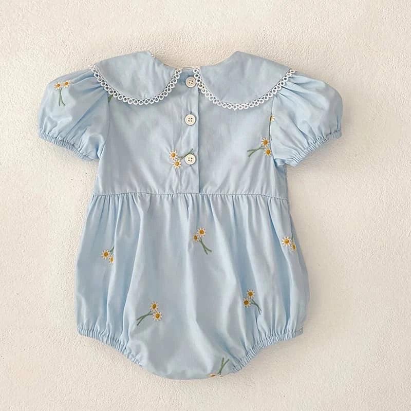 Light blue embroidered baby bubble romper with floral designs and decorative collar for infants