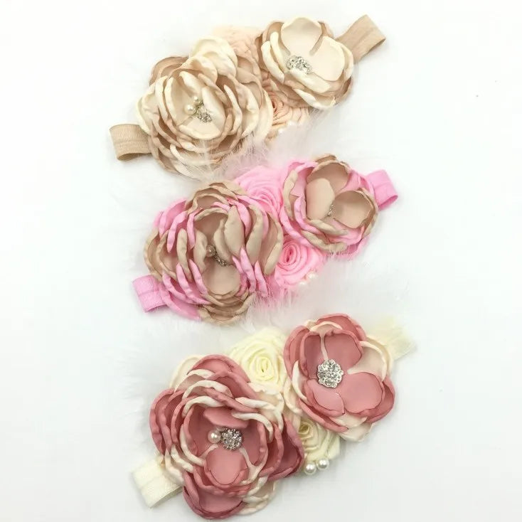 Elegant Chiffon Beaded Baby Hair Accessories showcasing three headbands with delicate pink and beige fabric flowers, embellished with rhinestones.