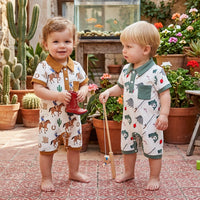 Two toddlers in Adorable Sporty Polo Style Short Sleeve Boys Rompers featuring western and fishing themes outdoors.