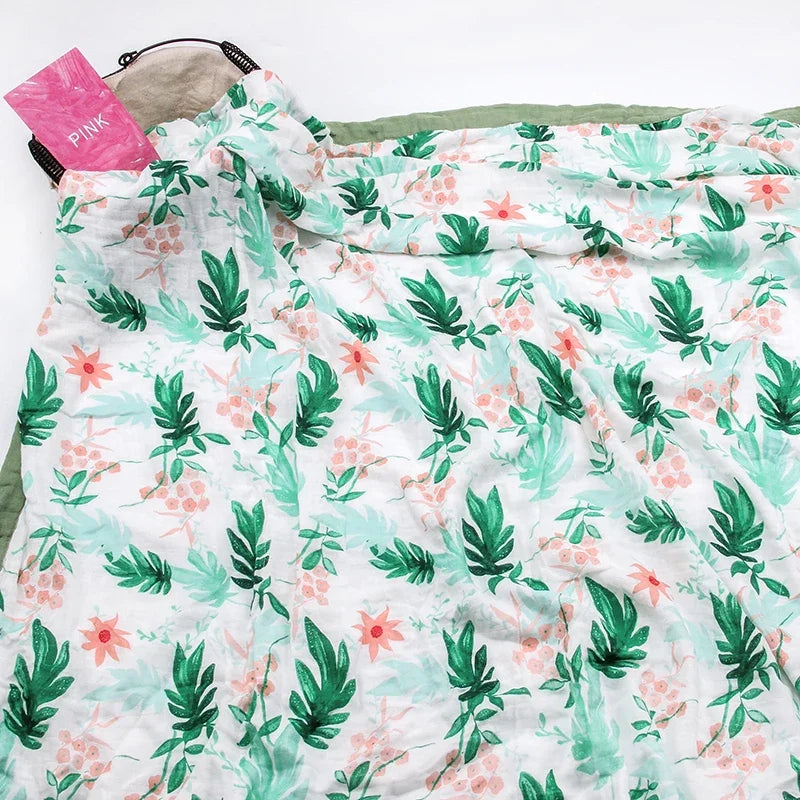 2-layer bamboo cotton baby blanket with green palm leaf pattern on white, newborn swaddle.
