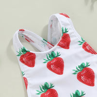 White one-piece toddler swimsuit with red strawberry print, crisscross back straps and frilly accents.