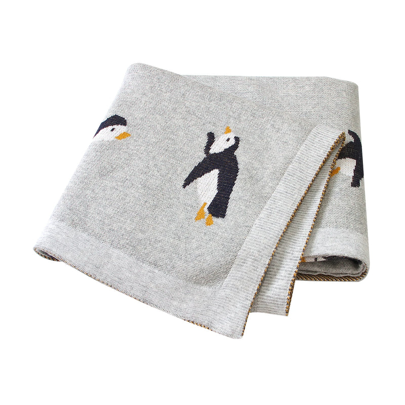 Another view of the Little Penguins Children's Knit Blanket showcasing its charming penguin theme, ideal for imaginative play.