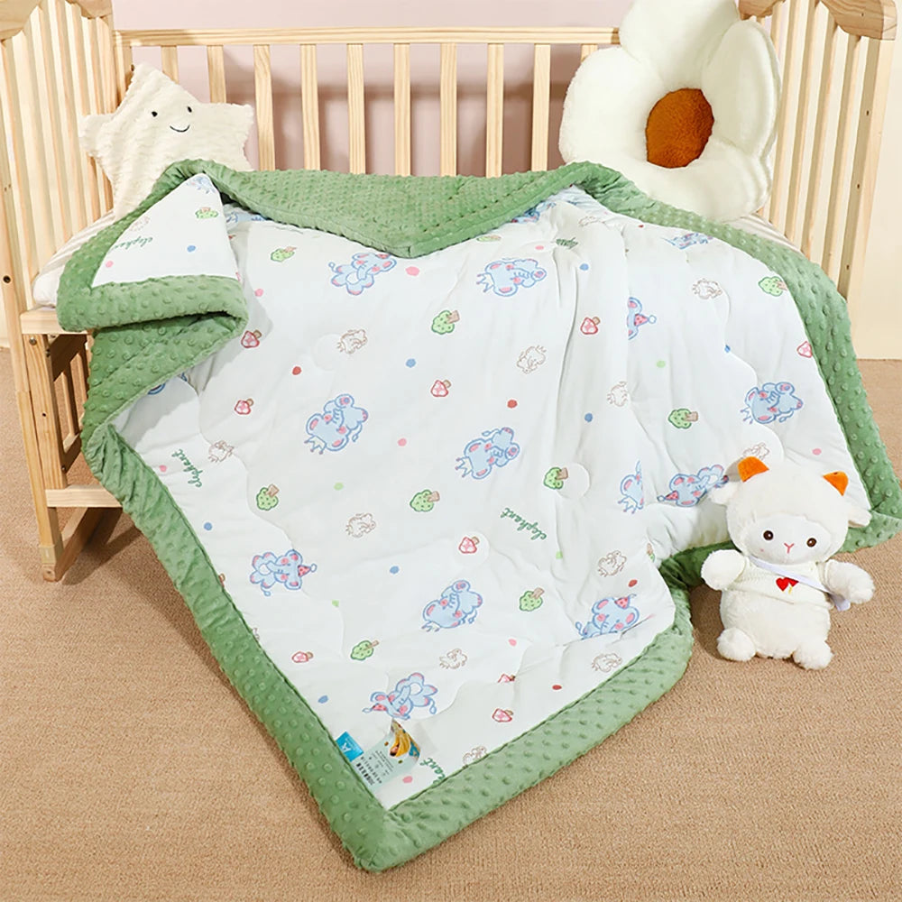 Quilted 120 x 150 cm kindergarten napping blanket with raised green dots and a printed side for toddlers.