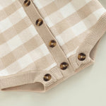Detail shot of the button closures on the Fallon Cozy Khaki Baby Knitted Romper, designed for easy dressing for babies 0-24 months.