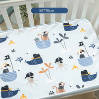 Waterproof baby changing pad cover, 50x70 cm, nautical prints with whales, boats, anchors on light blue.