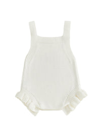 Cream knit sleeveless baby romper with two straps and ruffled leg cuffs.