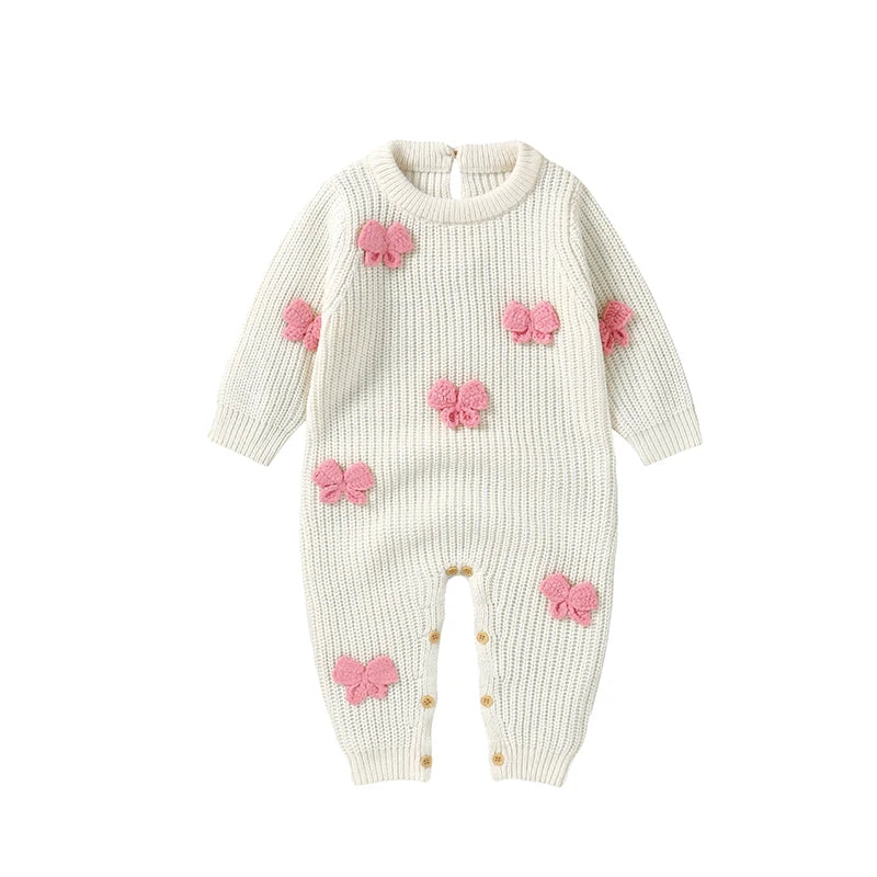 Little Bow Peep Crocheted Knit Baby Romper in cream adorned with pink crochet bows, designed as a cute knit baby outfit for little ones.